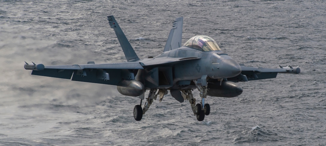 NORTH ARABIAN SEA (Jan. 9, 2021) An E/A-18G Growler, from the “Cougars” of Electronic Attack Squadron (VAQ) 139, approaches the flight deck of the aircraft USS Nimitz (CVN 68). Nimitz, the flagship of Nimitz Carrier Strike Group, is deployed to the U.S. 5th Fleet area of operations to ensure maritime stability and security in the Central Region, connecting the Mediterranean and Pacific through the Western Indian Ocean and three critical chokepoints to the free flow of global commerce. (U.S. Navy photo by Mass Communication Specialist Seaman Joseph Calabrese)