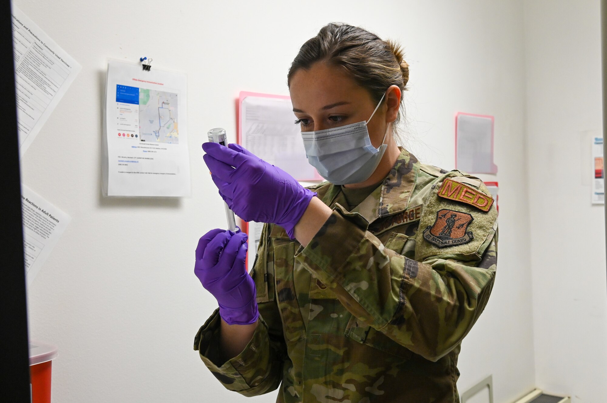 A medical technician assigned to the 115th Fighter Wing, Madison, Wisconsin, prepares to administer COVID-19 vaccines to essential military personnel Jan. 8, 2021. The Wisconsin National Guard was selected for 700 of the Moderna COVID-19 Vaccines by the Department of Defense. (U.S. Air National Guard photo by Senior Airman Cameron Lewis)