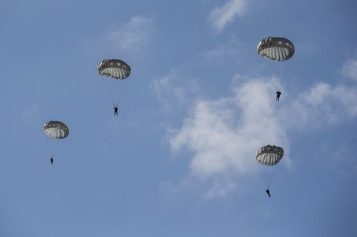 U.S. Marines parachute down to Drop Zone Basilone during a parachute operation on Marine Corps Base Camp Pendleton, Calif., Dec. 10.