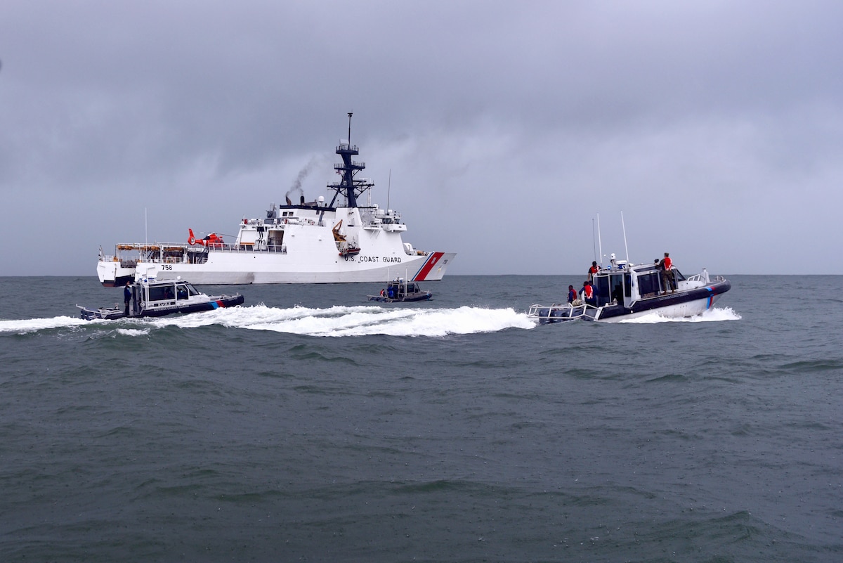 Guyana coast guard small boats patrol alongside the USCGC Stone (WMSL 758) off Guyana's coast on Jan. 9, 2021.