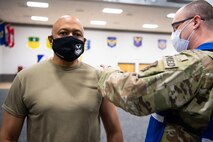 Lt. Gen. Anthony Cotton, Air Force Global Strike Command deputy commander, receives his COVID-19 vaccine at Barksdale Air Force Base, La., Jan. 11, 2021. AFGSC units are following the U.S. Department of Defense's COVID-19 vaccine distribution and administration plan which implements a phased, standardized and coordinated strategy for prioritizing, distributing and administering vaccines to those personnel vital to national security. AFGSC leaders received the COVID-19 vaccine in tier 1 of distribution due to their critical and essential roles in the national-security mission of nuclear enterprise command and control. AFGSC is comprised of more than 33,700 Airmen and civilians who diligently execute all bomber and Intercontinental Ballistic Missile operations for the U.S. DoD both stateside and in deployed locations around the globe. (U.S. Air Force photo by Airman 1st Class Jacob B. Wrightsman)