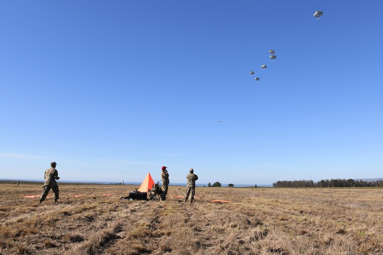 Soldiers assigned to the 346th Theater Aerial Delivery Company, an Army Airborne unit, and Marines, assigned to the 3rd Brigade, 3rd Air Naval Gunfire Liaison Company, Marine Forces Reserve, participate in tactical, low-level, static line parachute insertion operation training Jan. 9, 2021, at Vandenberg Air Force Base, Calif.