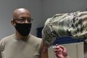 Air Force Chief of Staff Gen. Charles Q. Brown, Jr. receives the COVID-19 vaccine from Senior Airman Aidan Herring, an allergy technician with 316th Medical Squadron, at Joint Base Anacostia-Bolling, Washington, D.C., Jan. 12, 2021.