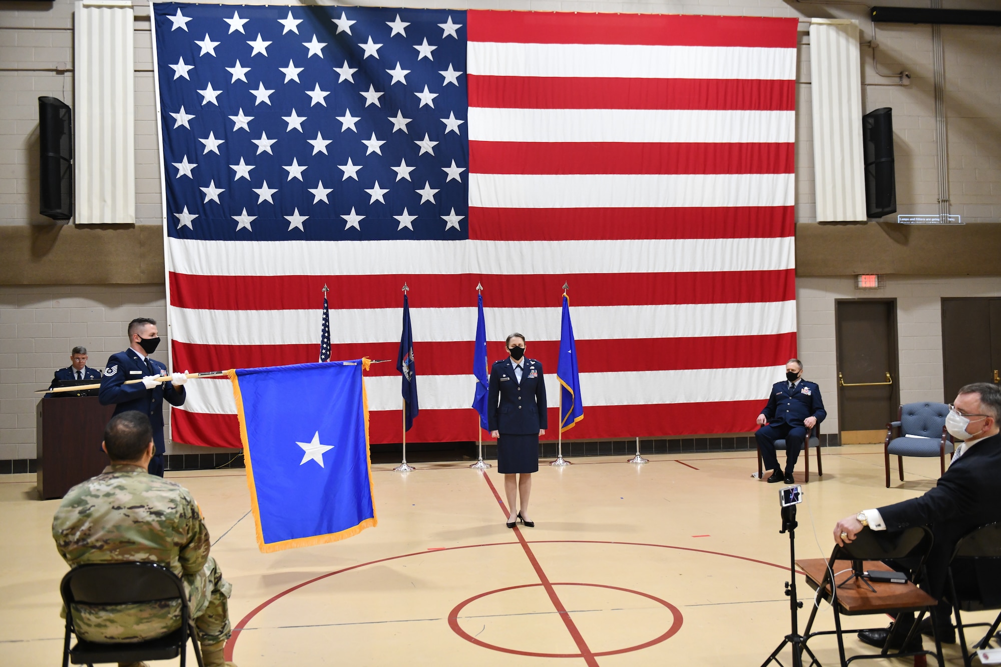 New York Air National Guard Brig.Gen. Denise Donnell stands at attention as her general officer's flag is unfurled during promotion ceremonies held on Wednesday, Jan. 6, 2021