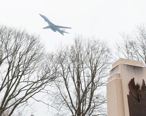 A U.S. Air Force B-1 Lancer Bomber flies over the Wright Brothers Memorial on Wright-Patterson Air Force Base, Ohio, Dec. 17, 2020. The flight was part of the annual ceremony marking the 117th anniversary of the first powered flight of an airplane. (U.S. Air Force photo by R.J. Oriez)