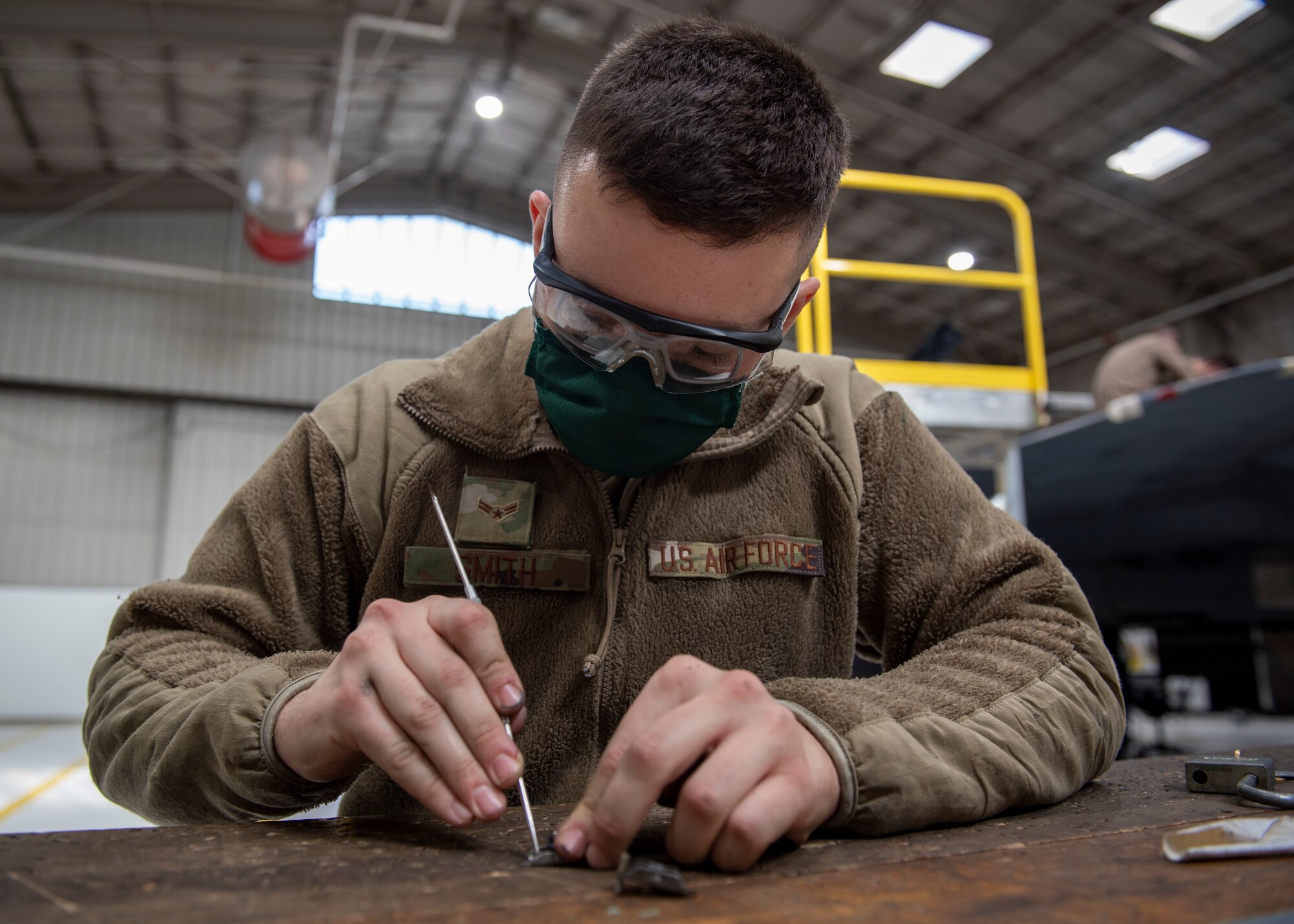 Airman 1st Class Noah Smith, 4th Equipment Maintenance Squadron aircraft structural maintenance crew chief, replaces a nut plate for a F-15E Strike Eagle at Seymour Johnson Air Force Base, North Carolina, Jan. 7, 2021.