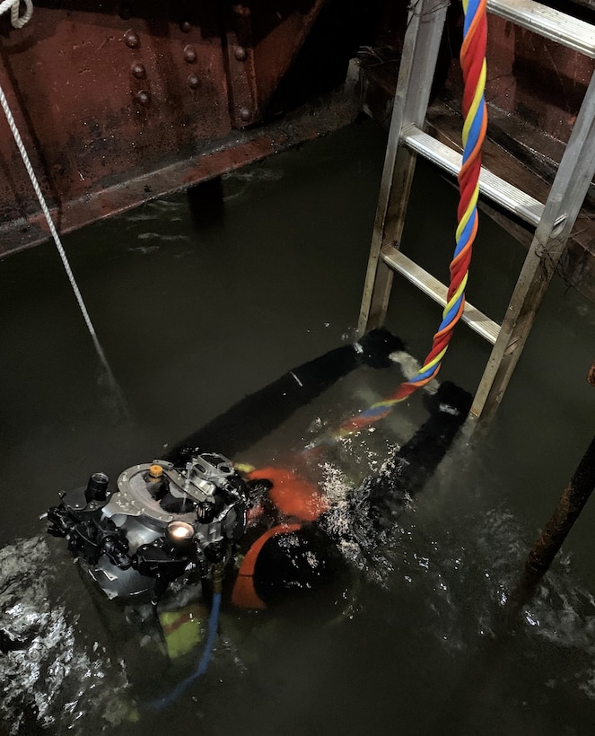 Matthew Proulx with the Soo Area Office, Detroit District U.S. Army Corps of Engineers, performs dive duties at the Soo Locks in Sault Sainte Marie, Michigan Jan. 12, 2021. Proulx’s dive duties included removing debris and a plug from the Davis Well before dewatering the Poe Lock as part of the Locks scheduled seasonal maintenance closing.