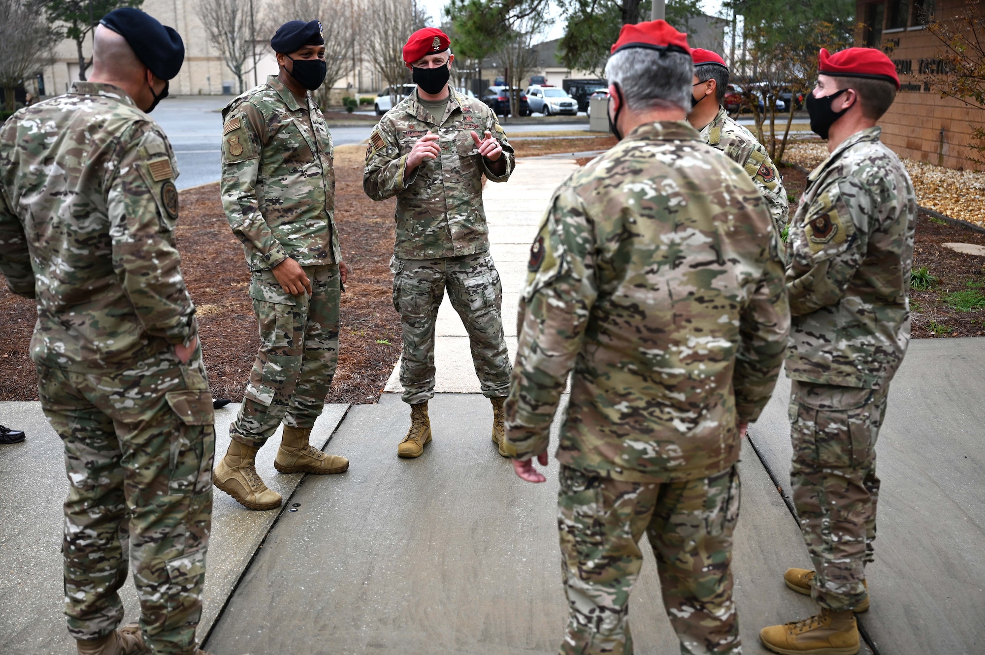 Brigadier General Roy Collins, left, director of Security Forces, deputy chief of staff for Logistics, Engineering and Force Protection, is introduced to members of the 23rd Special Tactics Squadron leadership team during a visit to Hurlburt Field, Fla., Jan. 11, 2021. During the tour, Collins and Chief Master Sgt. Brian Lewis, Security Forces career field manager, were briefed on the Deployed Aircraft Ground Response Element (DAGRE) training process, took part in a lasershot demonstration, and visited the 23rd STS compound for a mission briefing and a walk around the unit’s multilevel training and fitness facilities. (U.S. Air Force photo by Senior Airman Brandon Esau)