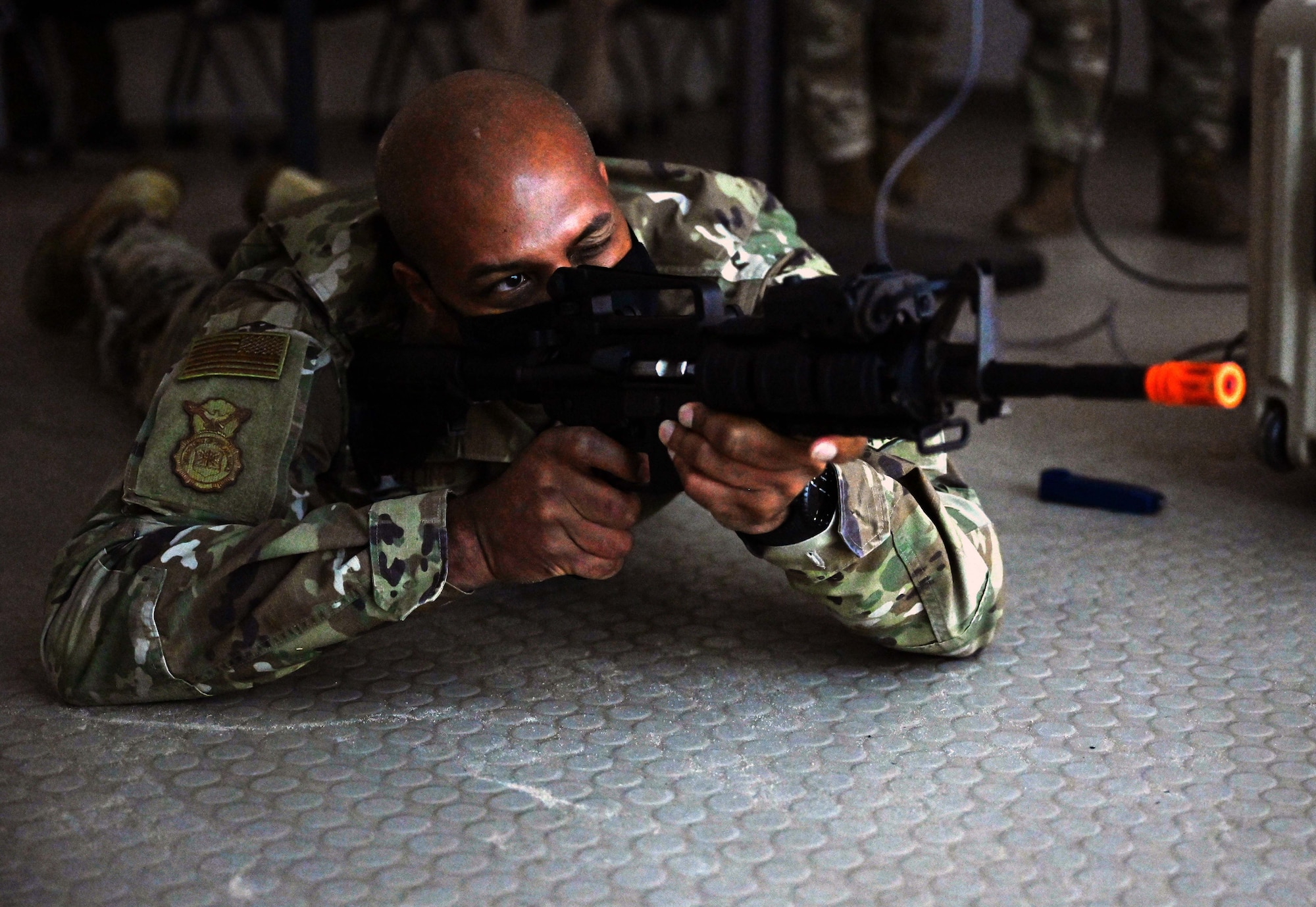 Brigadier General Roy Collins, director of Security Forces, deputy chief of staff for Logistics, Engineering and Force Protection, fires a lasershot demonstration at the 371st Special Operations Combat Training Squadron during his visit to Hurlburt Field, Fla., Jan. 11, 2021. Collins was joined by Chief Master Sgt. Brian Lewis, Security Forces career field manager, and toured the 371th SOCTS which included the demonstration, a Deployed Aircraft Ground Response Element (DAGRE) training brief, and a tour of the 23rd Special Tactics Squadron’s facilities. (U.S. Air Force photo by Senior Airman Brandon Esau)