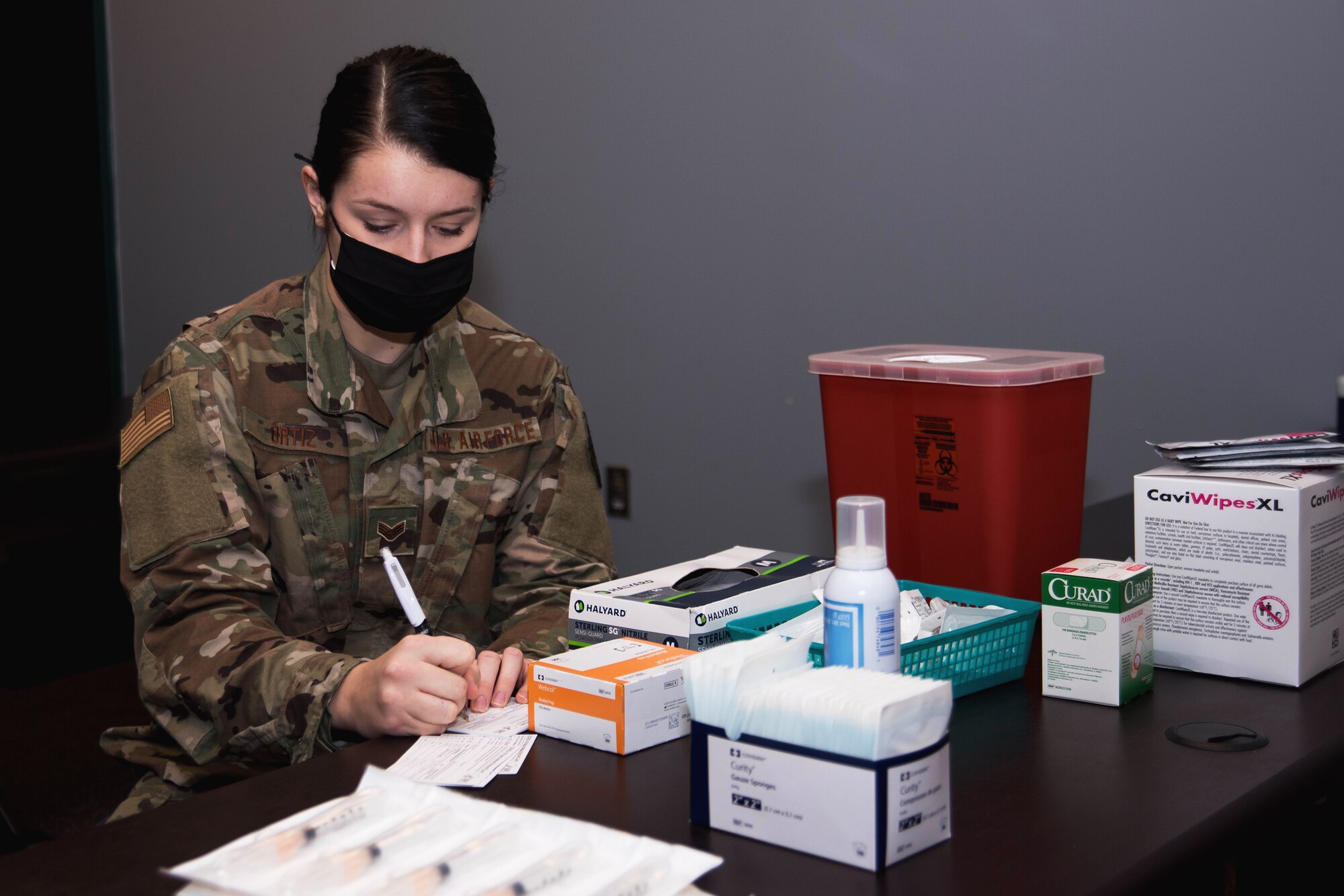 Image of an Airman working on paper work.