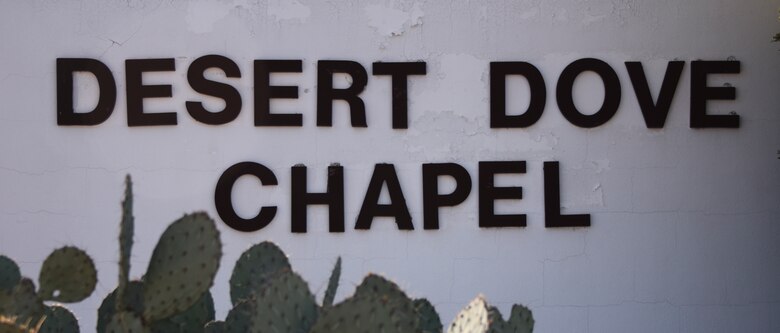 A sign that displays "Desert Dove Chapel".
