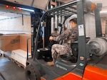 Members of the New York National Guard receive supplies build COVID-19 vaccination "pods" at the Guilderland Industrial Park, Altamont, N.Y., Jan. 5, 2021. The pods are all the items required to support a vaccination site, loaded into a New York State Department of Emergency Management trailer that can be transported anywhere across the state.