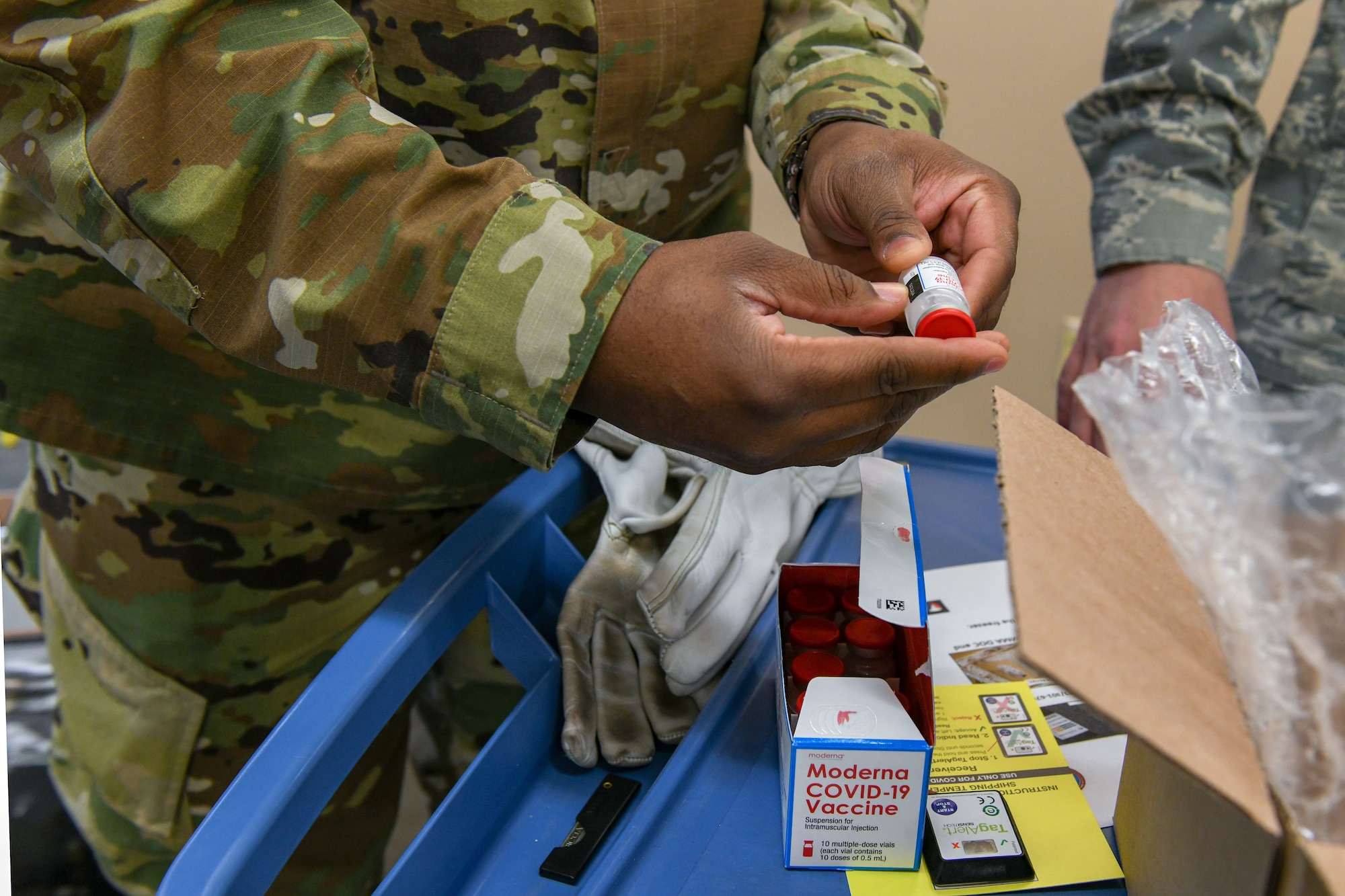 a man holds a vaccine