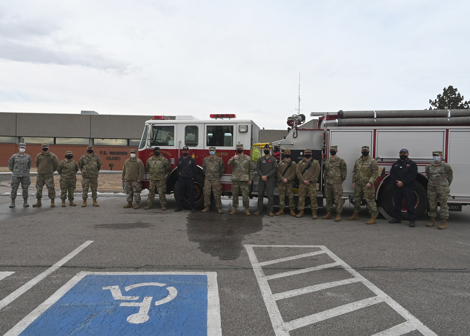 group photo in front of fire truck