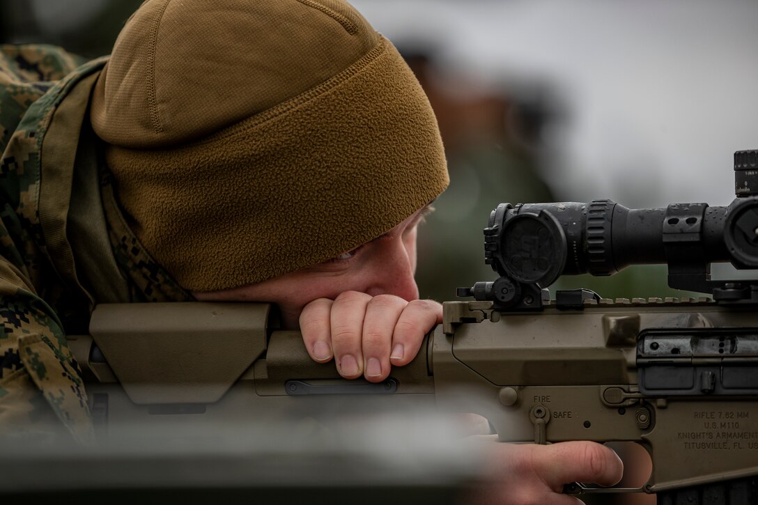 U.S. Marine Corps Lance Cpl. Zachary Larsen, a combat graphics specialist with Headquarters and Support Battalion, Marine Corps Installations Pacific – Marine Corps Base Camp Smedley D. Butler, sights in during a standoff munition disruption (SMUD) range on Camp Hansen, Okinawa, Japan, Jan. 8, 2020. SMUD is a technique used by explosive ordnance disposal technicians where they utilize a service weapon to disrupt and neutralize munition from a standoff distance in order to achieve a low-order detonation. (U.S. Marine Corps photo by Cpl. Brennan J. Beauton)