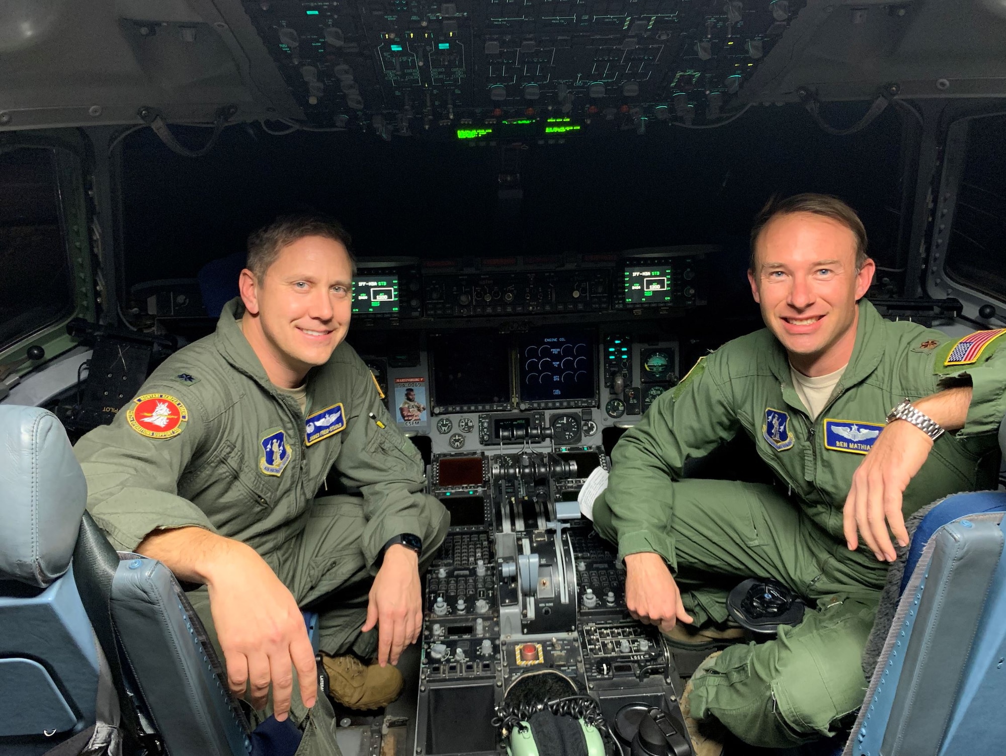 Lt. Col. James Freid-Studlo, 167th Operations Support Squadron commander, and Maj. Ben Mathias 167th Force Support Squadron commander, sit in the C-17 aircraft simulator at the 167th Airlift Wing, Martinsburg, W.Va. Freid-Studlo and Mathias both recently underwent pilot requalification training in the simulator after serving in other positions and not flying aircraft for an extended period of time.