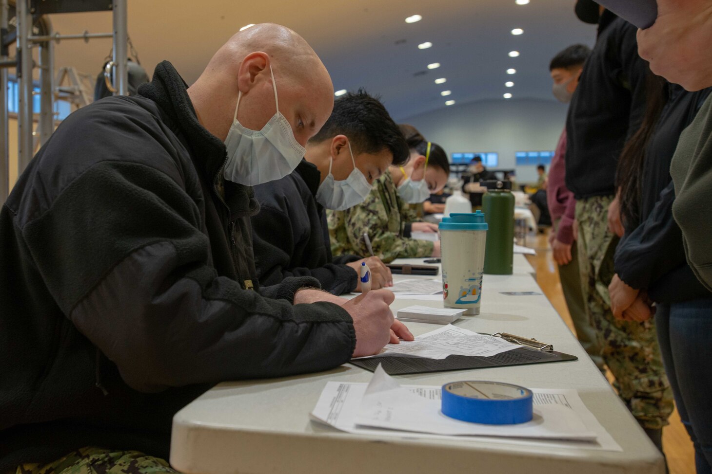 210108-N-LI114-1009 YOKOSUKA, Japan (Jan. 8, 2021) Sailors assigned to the U.S. Navy’s only forward-deployed aircraft carrier, USS Ronald Reagan (CVN 76), prepare to receive the COVID-19 vaccine on Commander, Fleet Activities Yokosuka (CFAY). Medical personnel and strategic forces were the first to receive the COVID-19 vaccine. Ronald Reagan returned to Yokosuka in November 2020 following a six-month deployment in the U.S. 7th Fleet area of responsibility.  (U.S. Navy photo by Mass Communications Specialist 3rd Class Michael B. Jarmiolowski)