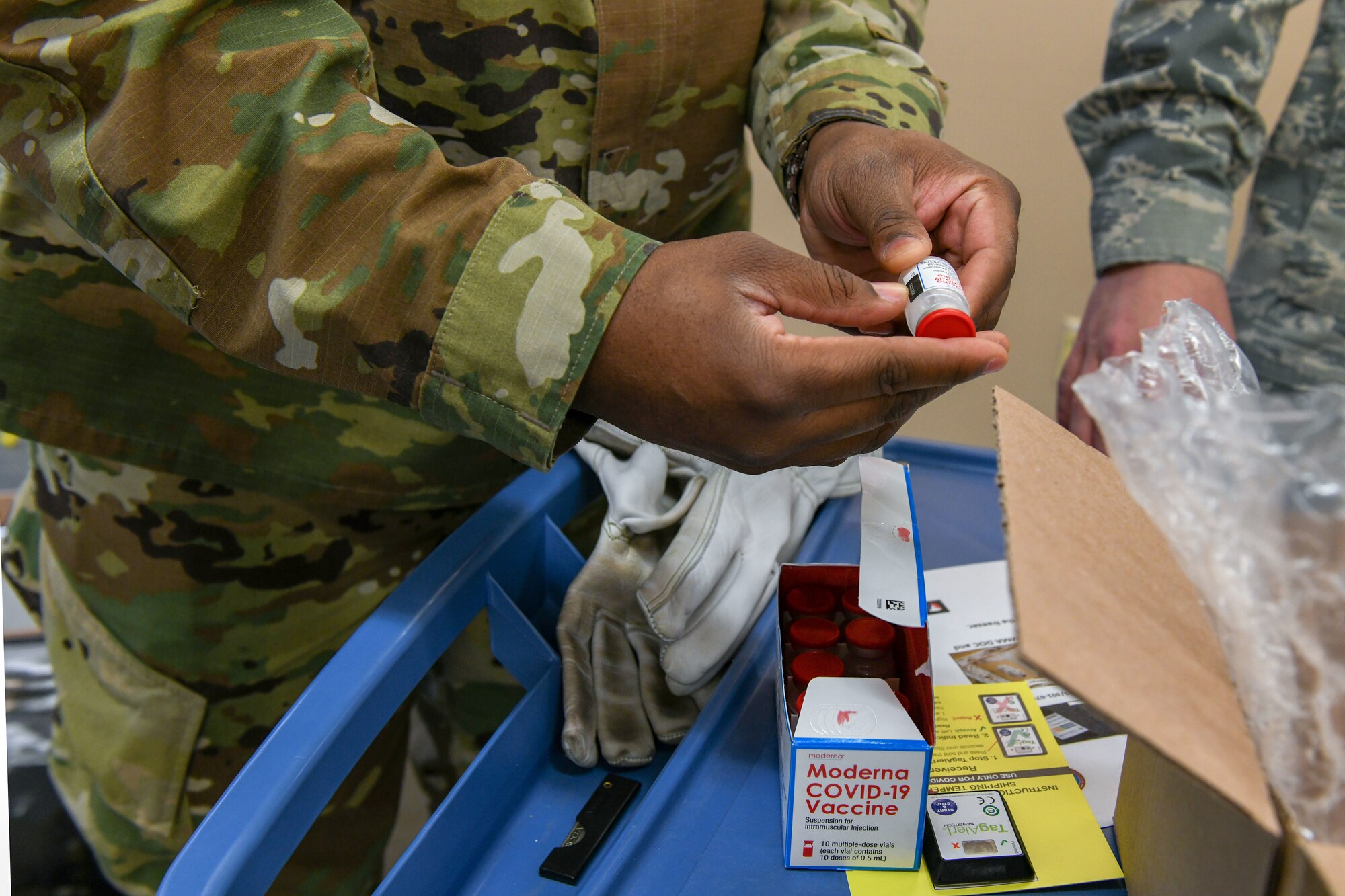 a man holds a vaccine