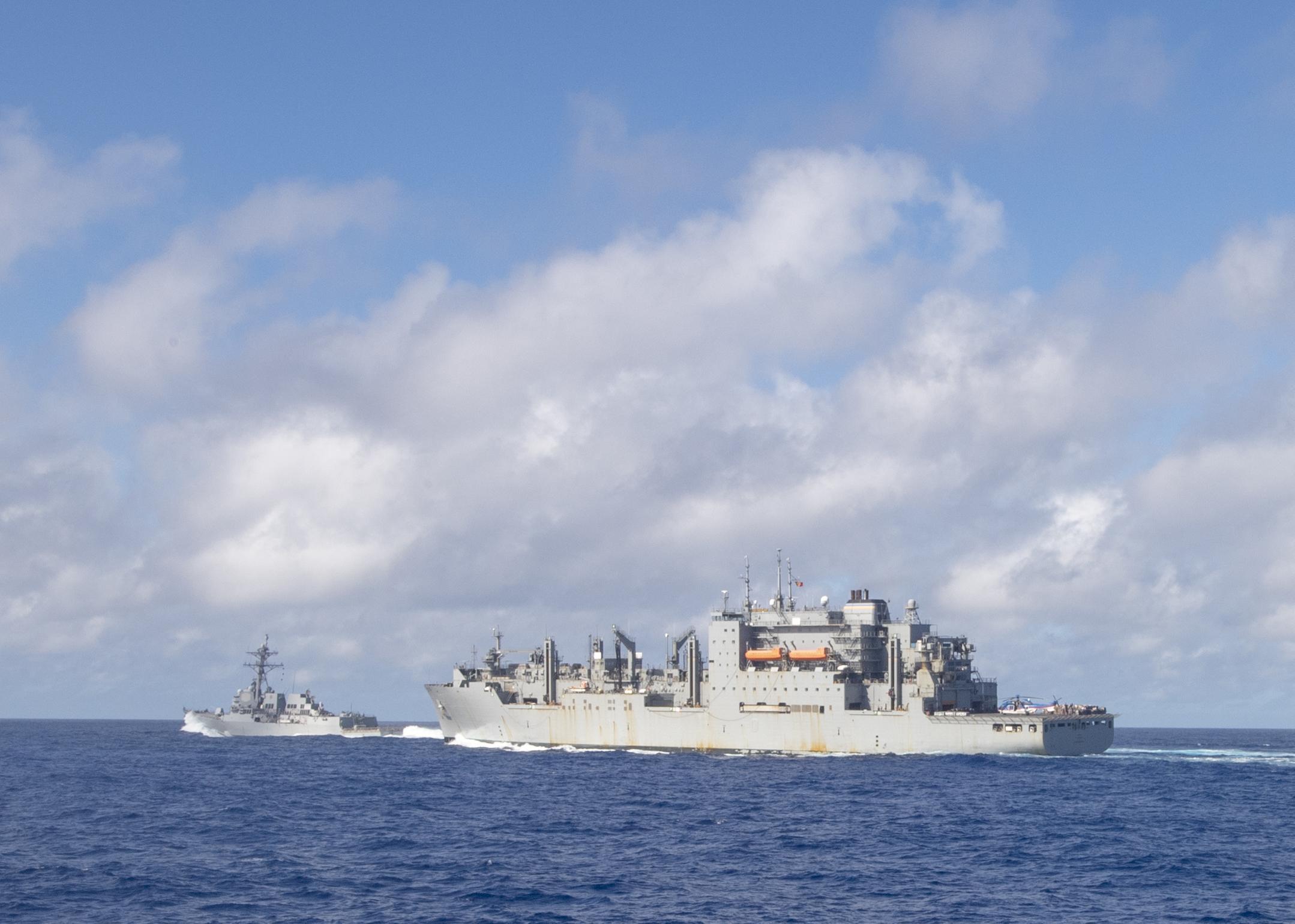 USS John Finn (DDG 113) transits with the Military Sealift Command dry cargo and ammunition ship USNS Charles Drew (T-AKE 10) after a replenishment-at-sea, Jan. 8, 2021.