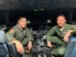 Lt. Col. James Freid-Studlo, 167th Operations Support Squadron commander, and Maj. Ben Mathias 167th Force Support Squadron commander, sit in the C-17 aircraft simulator at the 167th Airlift Wing, Martinsburg, W.Va. Freid-Studlo and Mathias both recently underwent pilot requalification training in the simulator after serving in other positions and not flying aircraft for an extended period of time.
