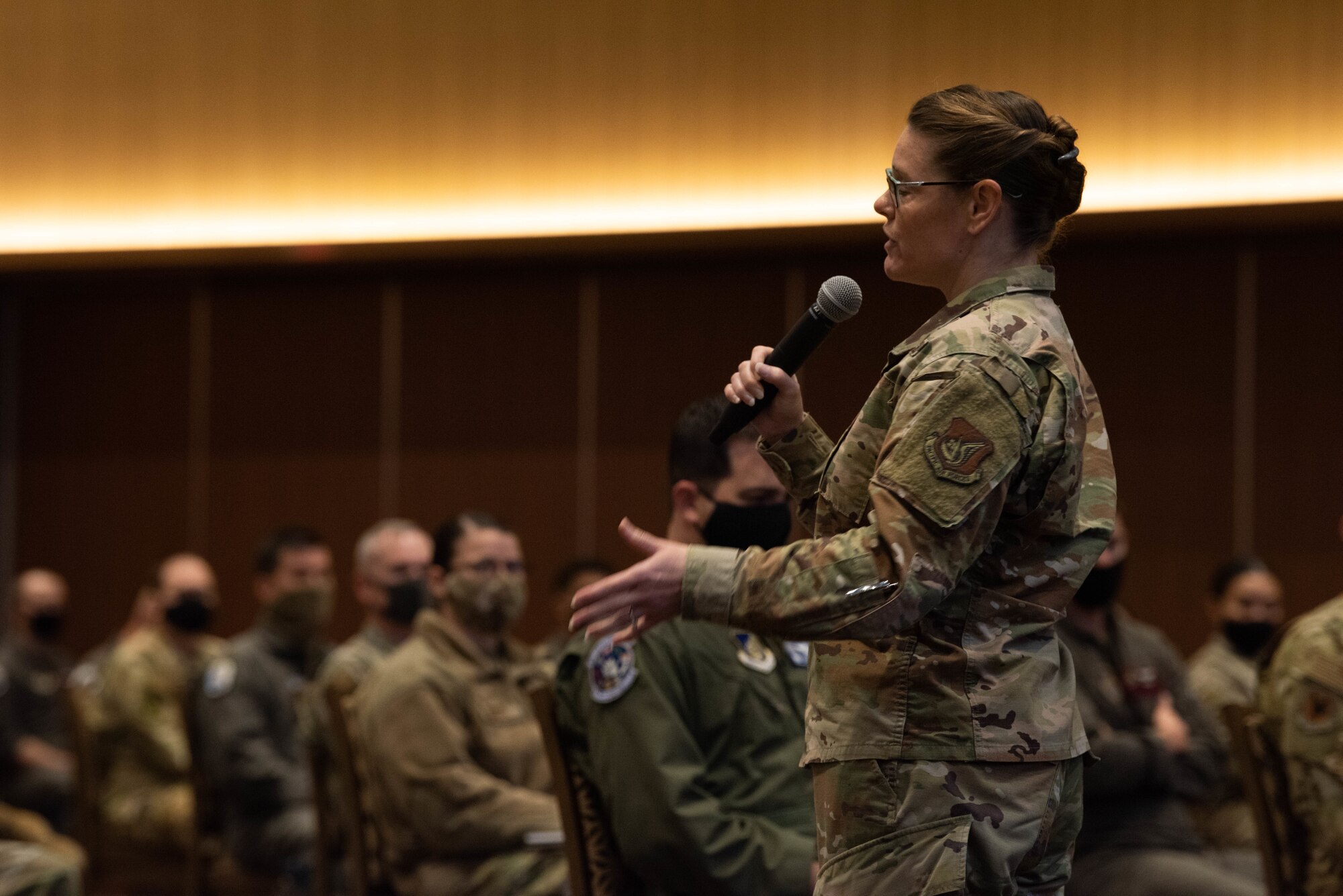 Chief Master Sgt. Jessica L. Bender, the 18th Wing command chief master sergeant, speaks to Airmen during an all-call at Kadena Air Base, Japan, Jan 7, 2021.  The all-call discussed resiliency, COVID, and pressing issues concerning the base. (U.S. Air Force Photo by Airman 1st Class Stephen Pulter)