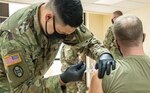 Members of the West Virginia National Guard participate in a COVID-19 vaccination clinic at Joint Forces Headquarters, Charleston, West Virginia, Jan. 13, 2021. West Virginia maintains one of the highest percentages of vaccine allocation use in the United States and is rapidly expanding capacity to inoculate the population.