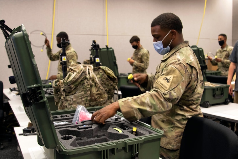 Soldiers inventory communications gear.