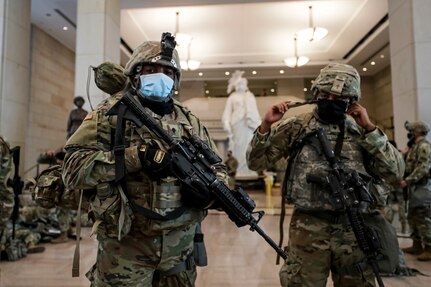 Virginia National Guard Soldiers prepare their gear resting in the Visitor Center in the U.S. Capitol in Washington, D.C., Jan. 13, 2021. National Guard Soldiers and Airmen from numerous states are in Washington to support to federal and district authorities for the presidential inauguration on Jan. 20.