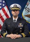 Studio portrat of Cmdr. Curnen.
