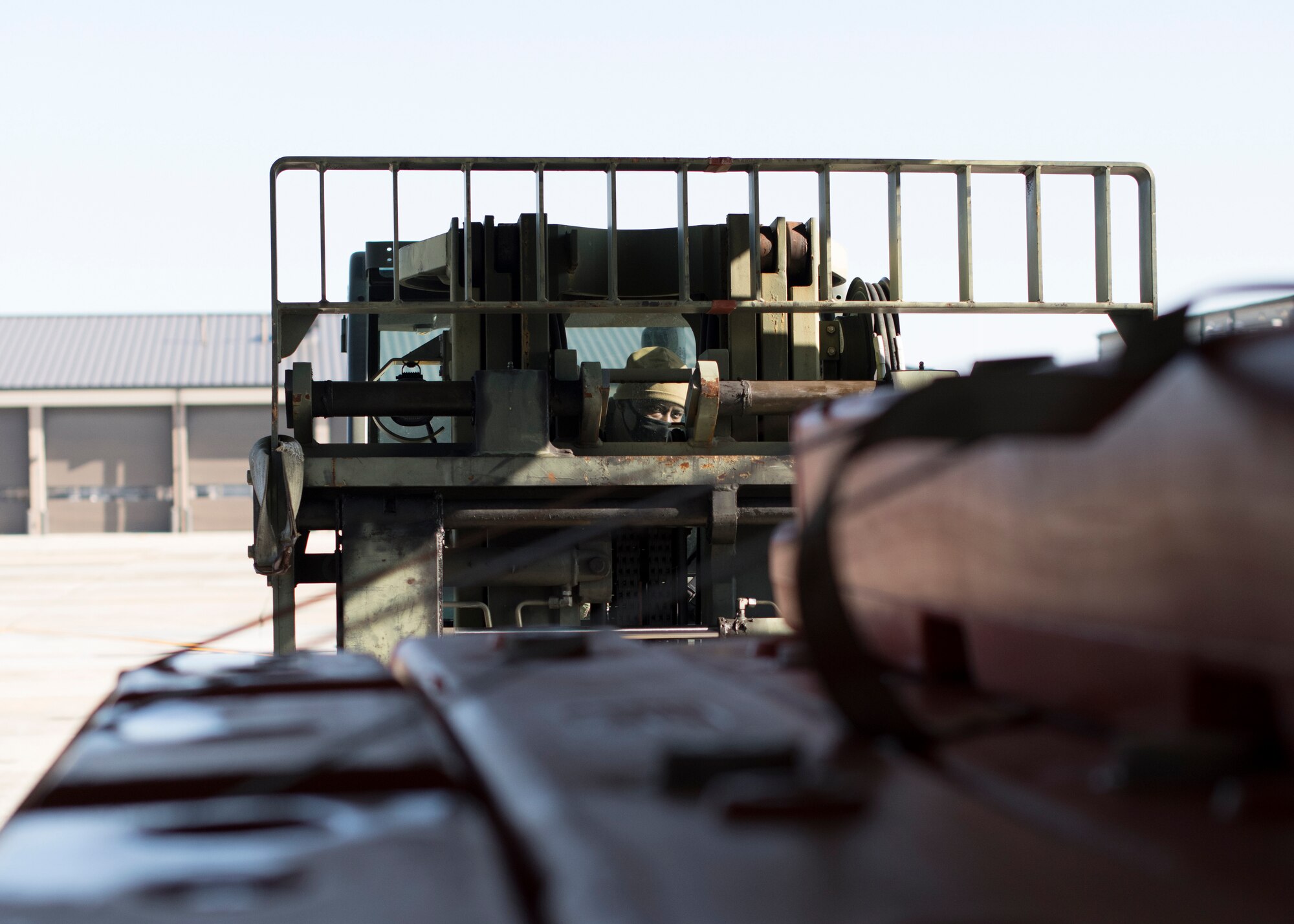 Tech. Sgt. Olalekan Adewale, 41st Aerial Port Squadron air transportation operations center technician, works to maneuver a pallet onto a WC-130J at Keesler Air Force Base, Miss., Jan. 13, 2020. The 41st APS serves a number of logistical functions including cargo and personnel processing, parachute packing, and loading and securing equipment.  (U.S. Air Force photo by Senior Airman Kristen Pittman)