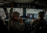 Construction Mechanic 1st Class Lucas Arriaga assigned to Maritime Expeditionary Security Squadron (MSRON) 11, relays course changes aboard a 34-foot Sea Ark patrol boat during a navigation check ride exercise off the coast of Long Beach, Calif.
