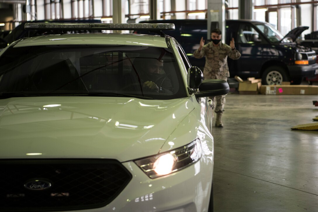 Challil Kessler, 86th Vehicle Readiness Squadron shop supervisor (left) and Senior Airman Jacob Croushore, 86 VRS vehicle mechanic, prepare to conduct a brake test on a 86th Security Forces Squadron vehicle at Ramstein Air Base.