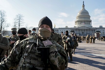U.S. Air Force Master Sgt. Sean Latimer, a crew chief with the New Jersey National Guard’s 177th Fighter Wing, stands in line after finishing a shift near the Capitol in Washington, D.C., Jan. 13, 2021. National Guard Soldiers and Airmen from multiple states have traveled to Washington to support to federal and district authorities for the inauguration of President-elect Joe Biden on Jan. 20.