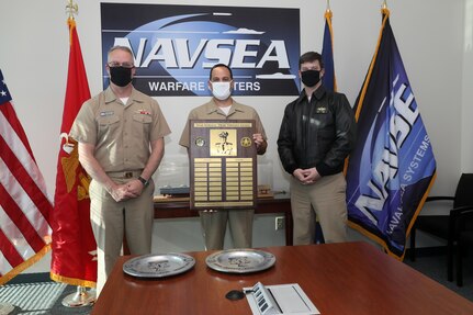 Rear Admiral Eric Ver Hage, Navy Regional Maintenance Center (CNRMC) and Director, Surface Ship Maintenance and Modernization (SEA 21) presented the Rear Admiral "Deak" Parsons award to Capt. Thomas Dickinsson and CMDR Tyson Young in a ceremony at the Washington Navy Yard.