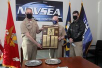 Rear Admiral Eric Ver Hage, Navy Regional Maintenance Center (CNRMC) and Director, Surface Ship Maintenance and Modernization (SEA 21) presented the Rear Admiral "Deak" Parsons award to Capt. Thomas Dickinsson and CMDR Tyson Young in a ceremony at the Washington Navy Yard.