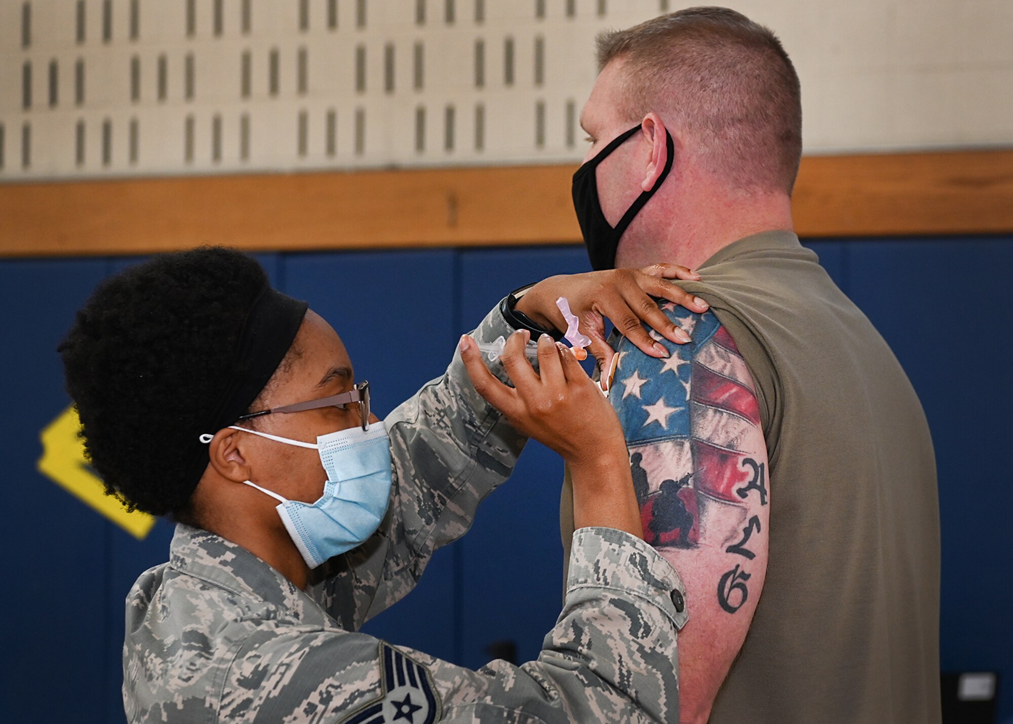 Staff Sgt. Tyler Watkins, 66th Medical Squadron noncommissioned officer in charge of immunizations, administers the COVID-19 Vaccine to Chief Master Sgt. Justin Geers, 66th Security Forces Squadron manager, at Hanscom Air Force Base, Jan. 14. (U.S. Air Force photo by Todd Maki)