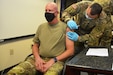 Maj. Gen. Mark Schindler, acting adjutant general of Pennsylvania, receives the COVID-19 vaccine from Master Sgt. Jose Martinez, a medical operations non commissioned officer with the Pennsylvania National Guard, on Jan. 13, 2021, at Fort Indiantown Gap, Pa. (Photo by Brad Rhen)