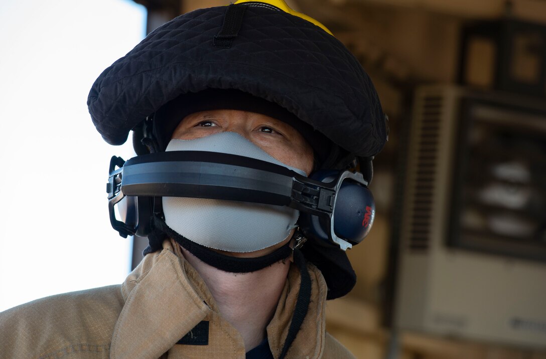 A fire fighter assigned to the 374th Civil Engineer Squadron fire department, operates the newly installed flightline BAK-12 barrier, aircraft arresting system (AAS)