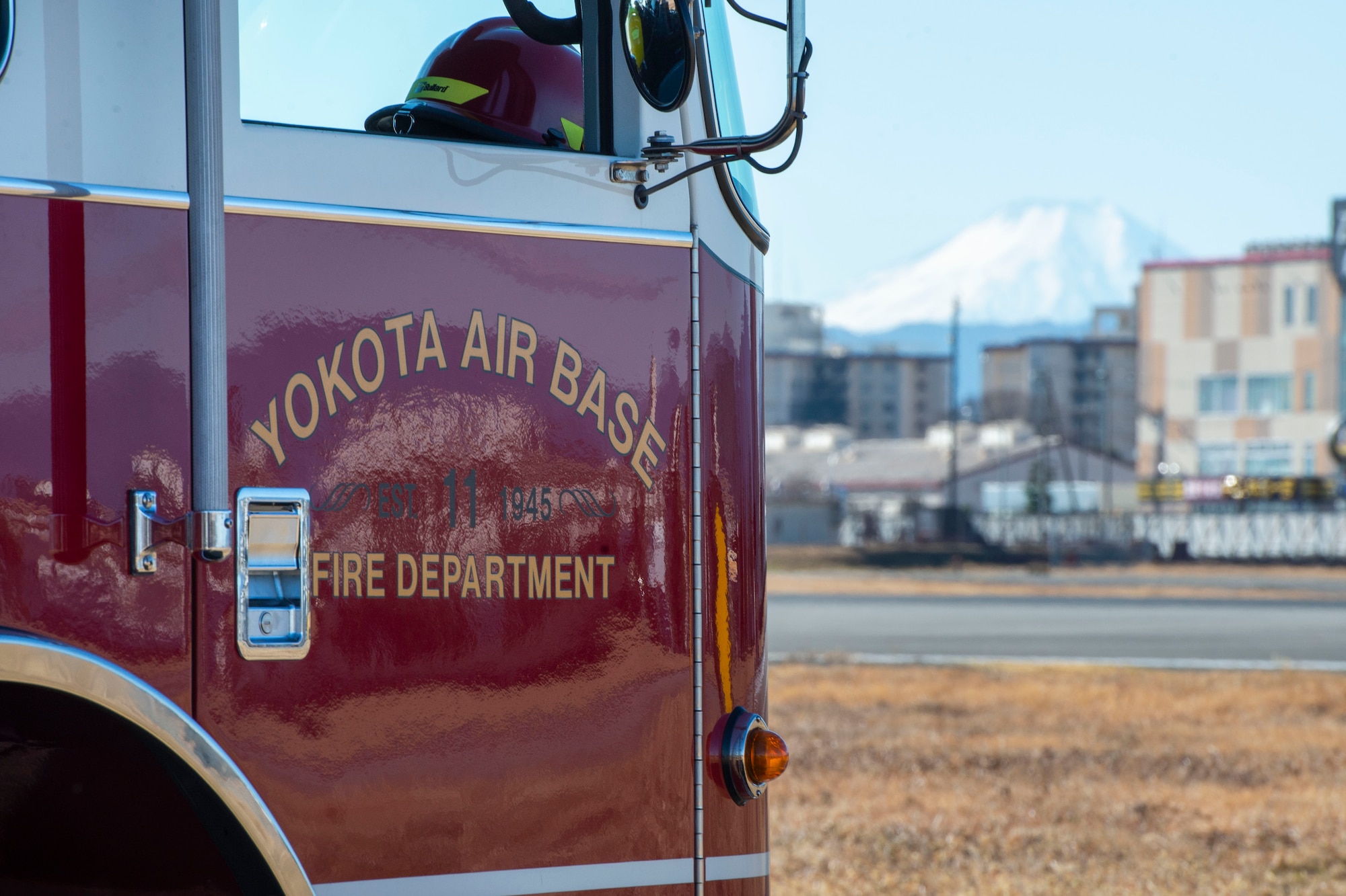 A firetruck assigned to the 374th Civil Engineer Squadron fire department provides assistance in the case of an emergency during the initial certification test of the newly installed flightline BAK-12 barrier, aircraft arresting system (AAS)