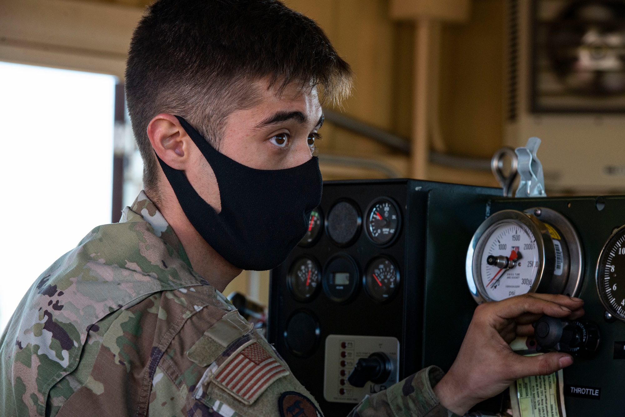 Airman Eric Christenson, 374th Civil Engineer Squadron electrical power productions shop apprentice, operates the newly installed flightline BAK-12 barrier, aircraft arresting system (AAS)