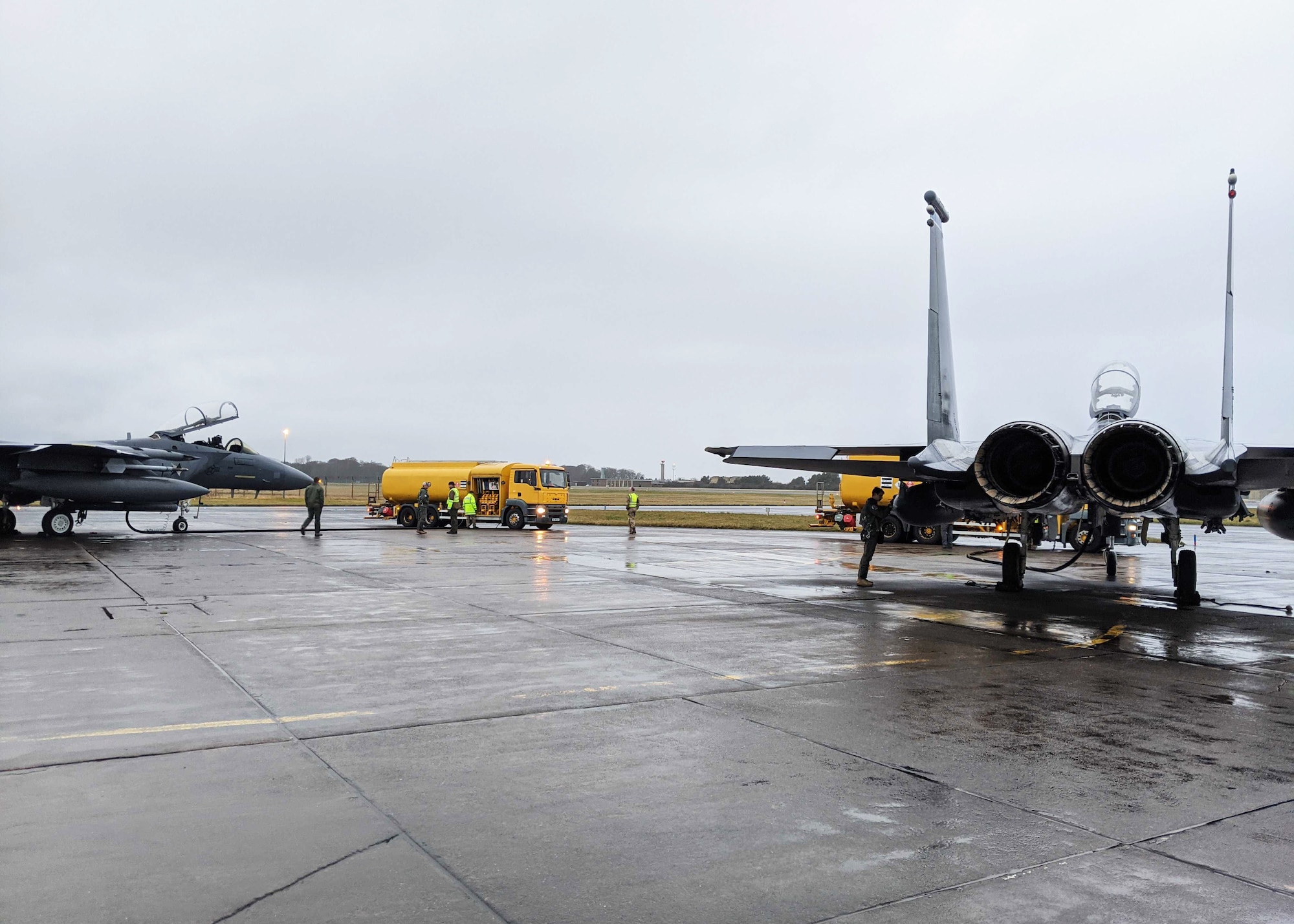 F-15E Strike Eagles assigned to the 492nd Fighter Squadron receive fuel during an Agile Combat Employment exercise at Royal Air Force Leuchars Airfield, Scotland, Jan. 11, 2021. Agile Combat Employment ensures U.S. Air Forces in Europe, along with allies and partners, are ready for potential last minute contingencies by allowing forces to operate from locations with varying levels of capacity and support. (Courtesy photo)