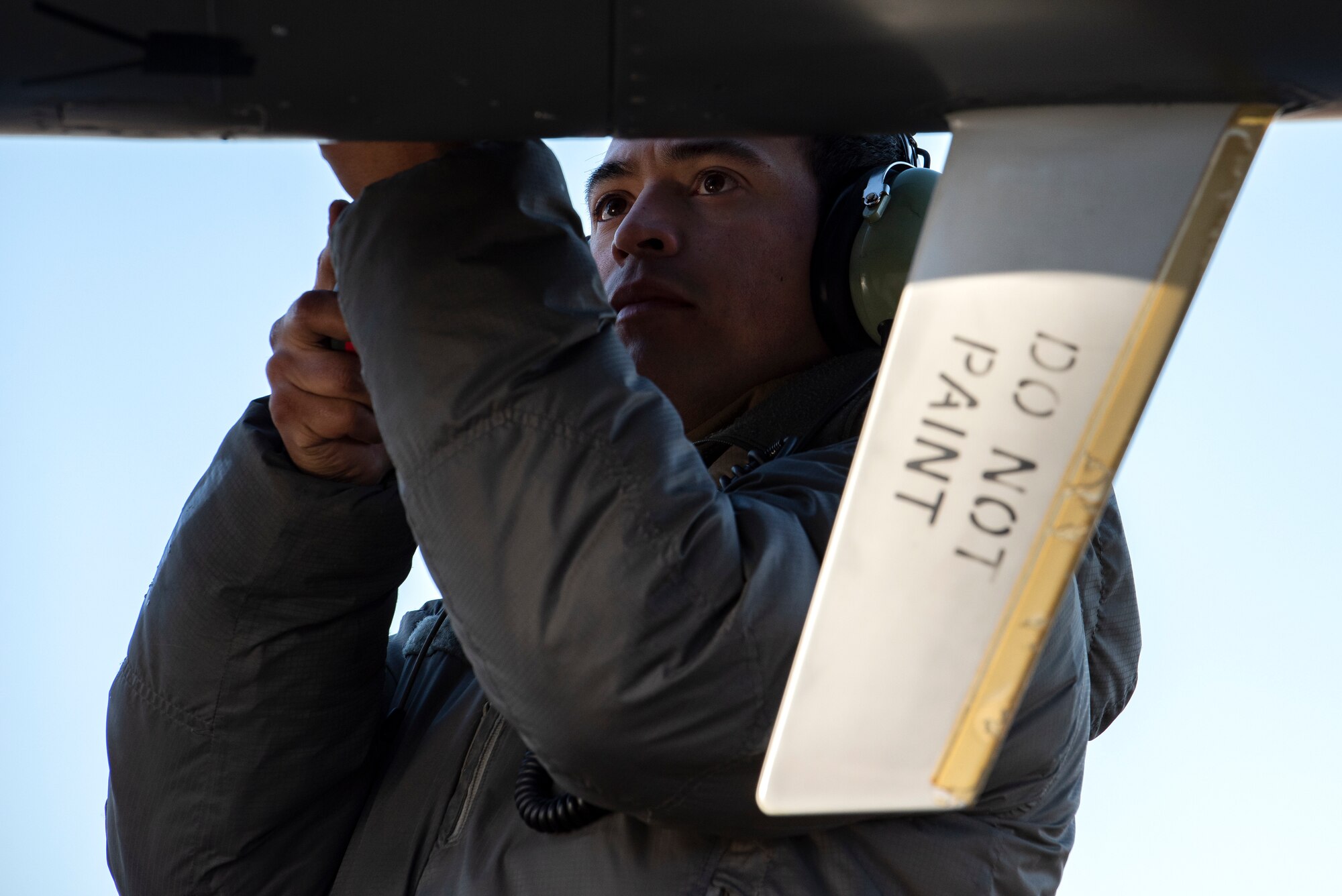 U.S. Air Force Staff Sgt. Miguel Talamantes, 492nd Aircraft Maintenance Unit crew chief, secures a panel on an F-15E Strike Eagle during Agile Combat Employment training at Royal Air Force Lakenheath, England, Jan. 12, 2021. Training incorporating ACE concepts contribute to the development of multi-capable Airmen and aircrew, improving interoperability and helping allies and partners increase their capabilities in less than optimal environments. (U.S. Air Force photo by Airman 1st Class Jessi Monte)