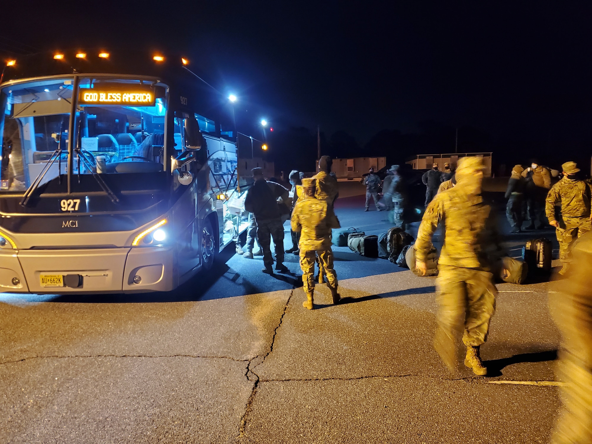 Before traveling to Washington D.C. to provide security, protect National Monuments, and ensure a peaceful transfer of power, members of the 177th Fighter Wing of the New Jersey Air National Guard load equipment and supplies onto a charter bus, Jan. 8, 2021, at the Atlantic City Air National Guard Base, N.J. New Jersey Air and Army National Guard members then processed through the Joint Reception, Staging, Onward movement, and Integration function with Joint Task Force 44, at the New Jersey National Guard Training Center, in Sea Girt, N.J. The JRSOI included a briefing, medical examinations and an administrative records review. (U.S. Air National Guard courtesy photo by Col. Aaron M. Dunn)