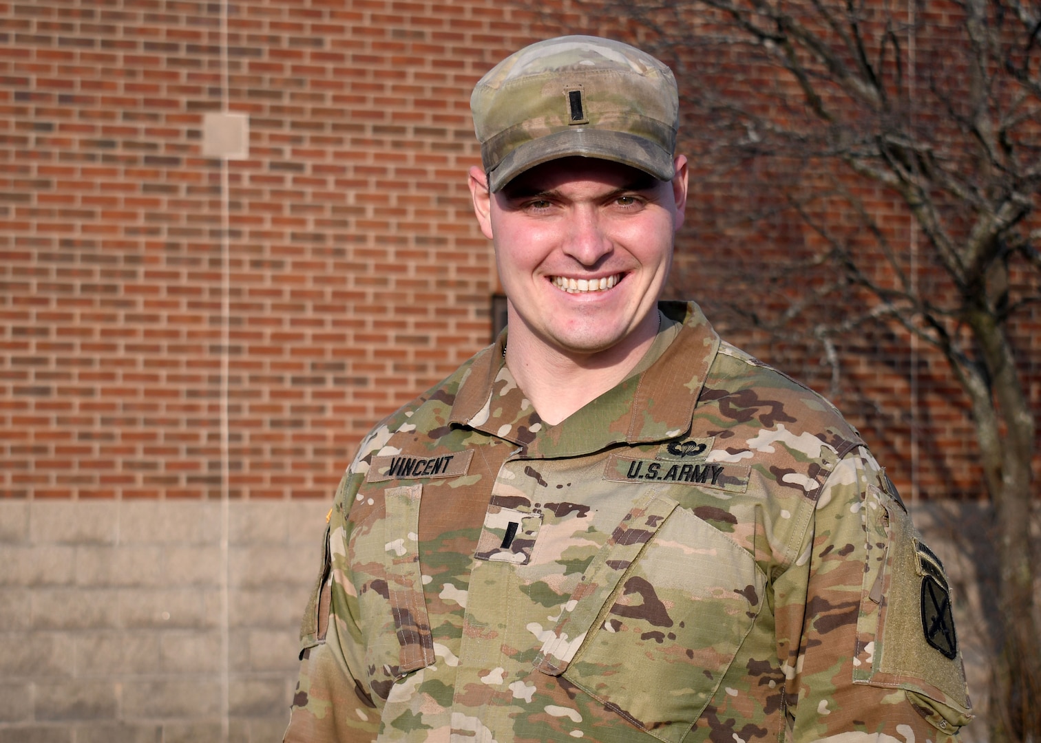 FORT DRUM, N.Y. – 1st Lt. Thomas Vincent, an infantry officer with 2nd Battalion, 22nd Infantry Regiment, 1st Brigade Combat Team, 10th Mountain Division (Light Infantry), stands in front of his company headquarters on Fort Drum, N.Y. Dec. 11, 2020.  Following a severe car accident resulting in multiple injuries, Vincent spent nearly a year in recovery assigned to the Fort Drum Soldier Recovery Unit before overcoming his injuries and returning to duty in late November 2020.