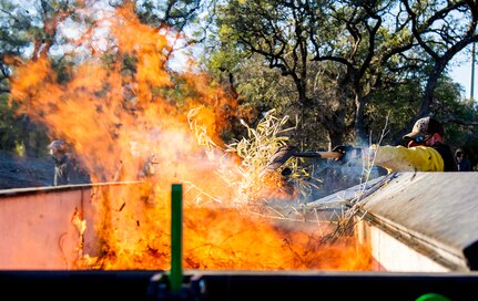 Work crews made up of members of the 802nd Civil Engineer Squadron, Joint Base San Antonio Natural Resources Office, Texas A&M Natural Resources Institute and the JBSA Wildland Support Module burned golden bamboo and cedar mulch