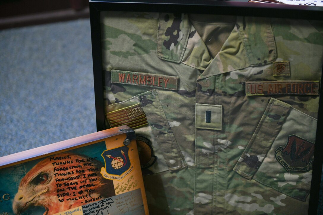 A uniform in a shadow box, and other mementos