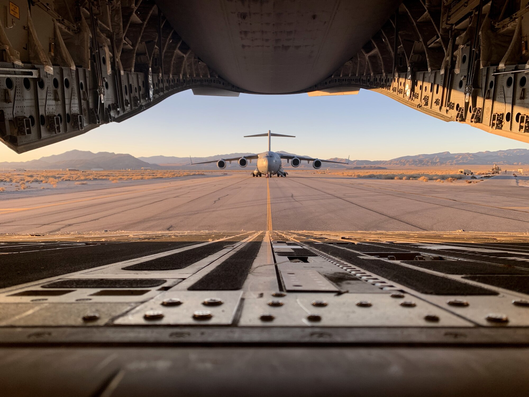 A C-17 Globemaster III assigned to the 3rd Airlift Squadron prepares to load personnel and equipment in support of the Joint Forcible Entry exercise at Nellis Air Force Base, Nevdada, Dec. 5, 2020.  The 436th AW supported exercise JFE 19B by sending C-17 aircraft to the Nevada Test and Training Range to conduct airlift operations. (U.S. Air Force courtesy photo)