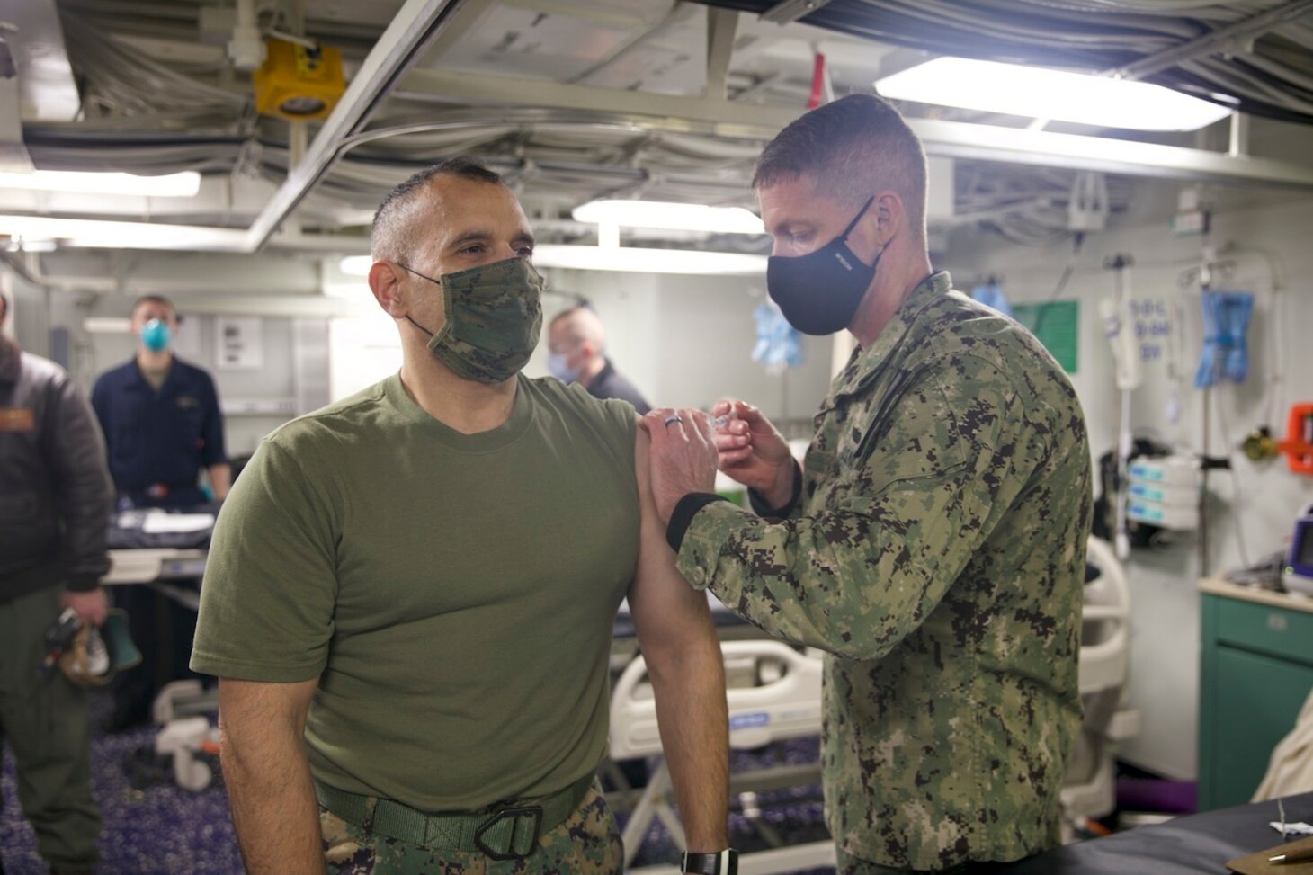 Col. Brian Duplessis, deputy commander, Expeditionary Strike Group (ESG) 2, receives the COVID-19 vaccination aboard the amphibious transport dock ship USS San Antonio (LPD 17), Jan. 11, 2021.