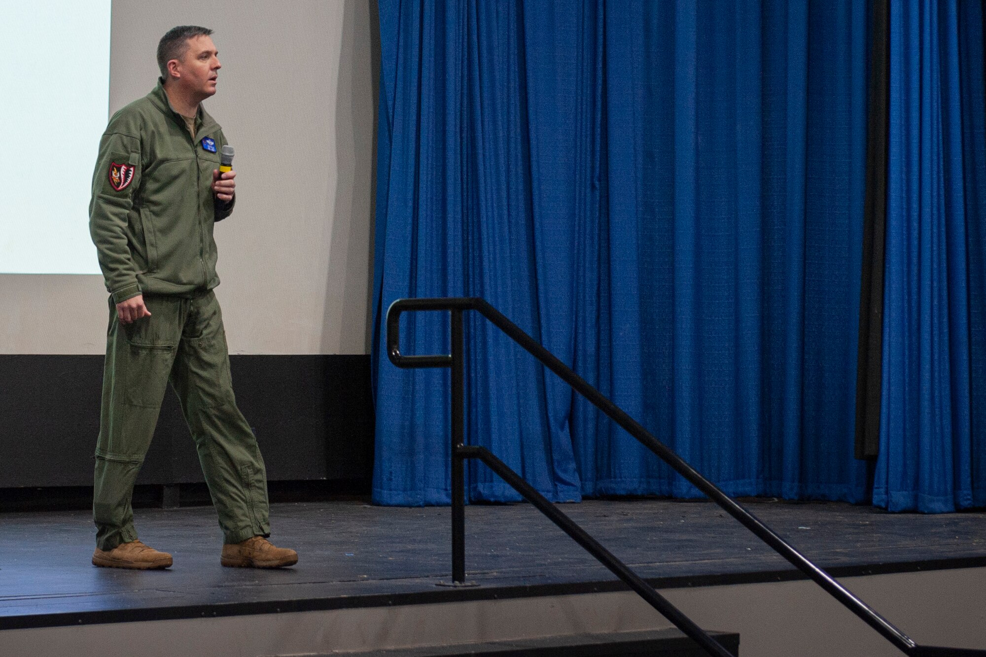 Photo of Col Walls speaking during a briefing