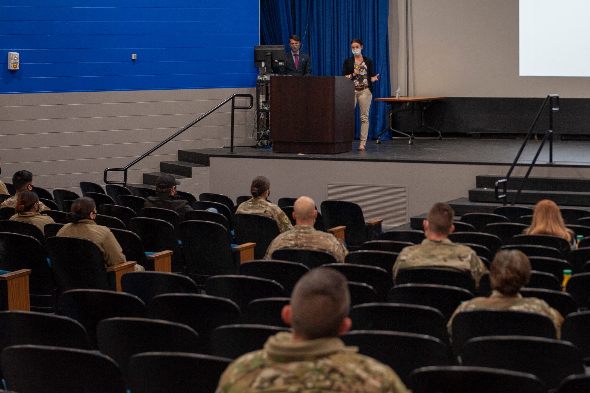 Photo of Airmen listening to a briefing